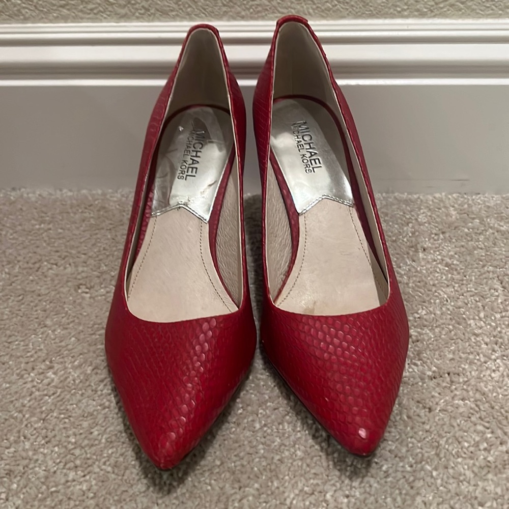 Red snakeskin pumps by Michael Kors, size 8